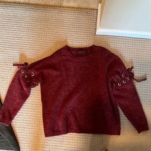 red sweater with sleeve detail